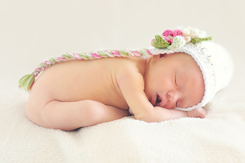 Small Baby Laying on a Blanket - Birth Trauma